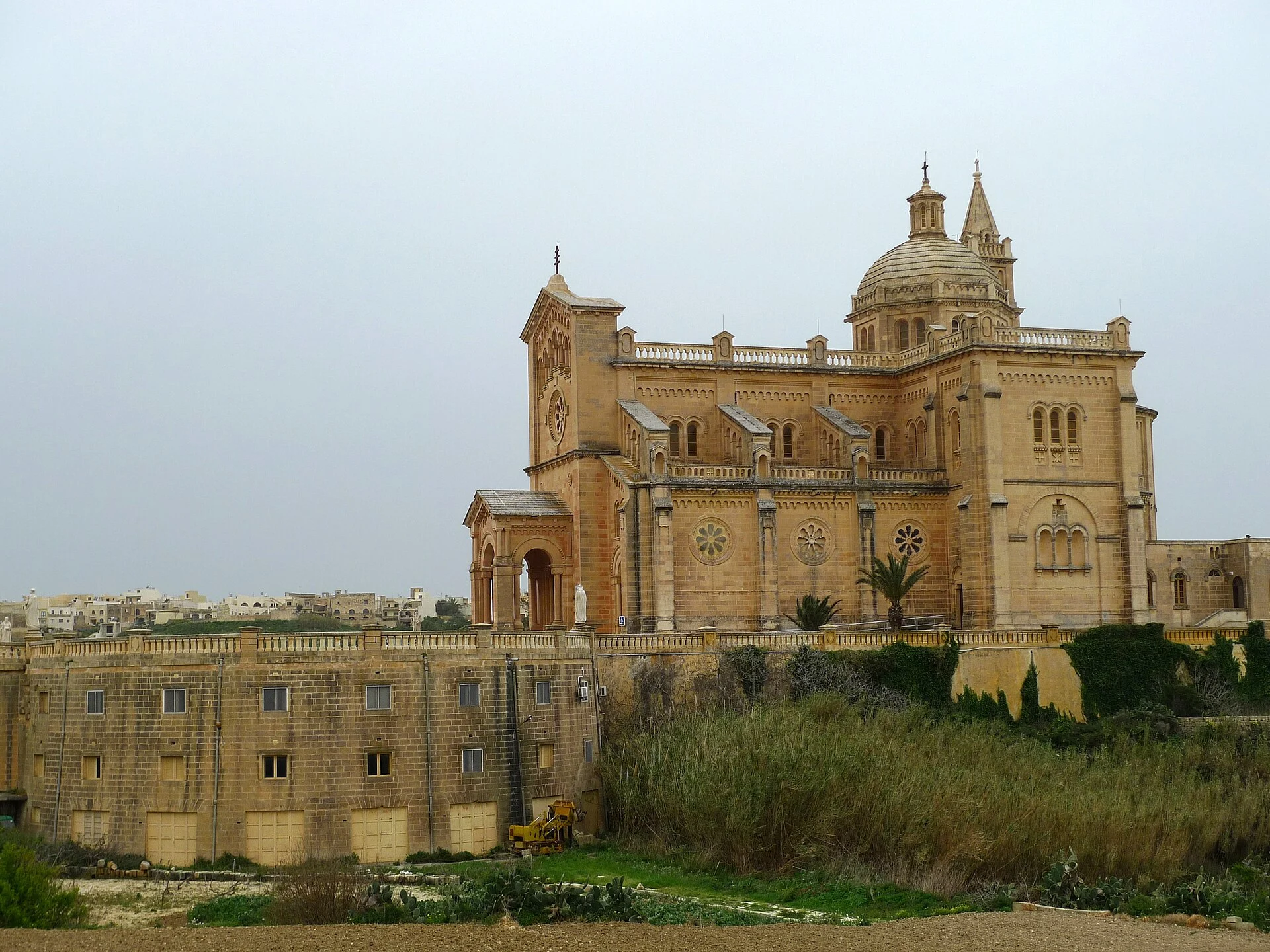 Ta’ Pinu Basilica seen beyond a green field on Gozo.